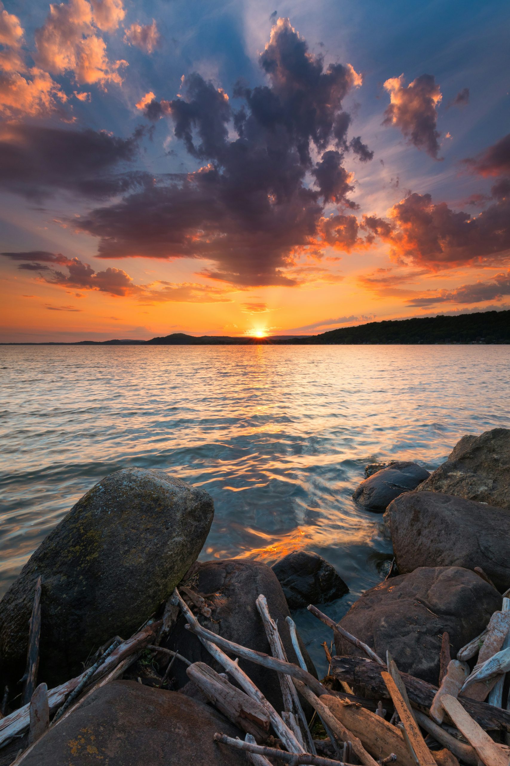 Peaceful wooded lake representing online trauma therapy in Wisconsin